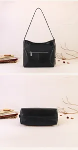 Black soft leather shoulder bag with spacious interior, minimalist underarm hobo style design.