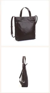 Detailed view of dark brown leather tote bag featuring adjustable shoulder strap and dual handles.