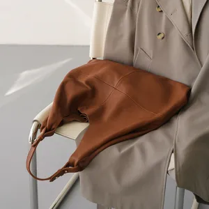 Brown genuine leather hobo shoulder bag for women, stylish urban commute tote bag.