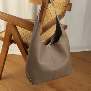 Casual leather hobo bag for women, large capacity shoulder tote for daily commute and travel.