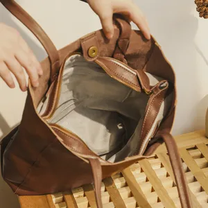 Classic brown leather tote bag for women, large capacity minimalist shoulder bag for daily work.