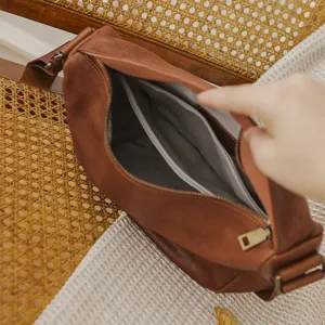 Brown genuine leather dumpling shoulder bag, casual crossbody bag with zipper and inner pockets.