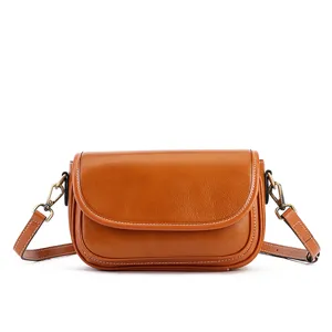 Brown leather crossbody shoulder bag for women, stylish niche design small square handbag main view.