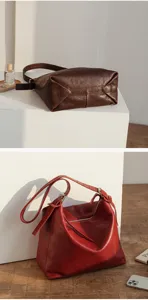 Detailed view of women's vintage leather shoulder bag, soft hobo tote bag with adjustable strap.