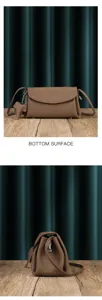 Detailed view of the soft leather cloud crossbody bag showing the bottom surface and side profile.