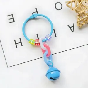 Detailed view of creative bell keychain with colorful letter beads and plastic chains.