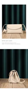 Leather crossbody bag detail view featuring soft beige cowhide material and a cute elephant charm.
