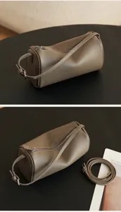 Soft leather cylindrical shoulder bag, minimalist casual crossbody handbag, stylish daily commuter purse.