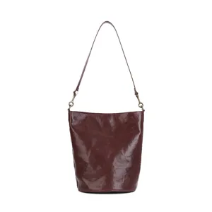 Genuine leather bucket bag for women, stylish underarm shoulder bag with metal hardware.