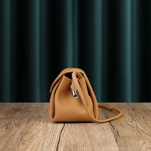 Genuine leather shoulder bag for women, soft cowhide crossbody bag with stylish fold design.