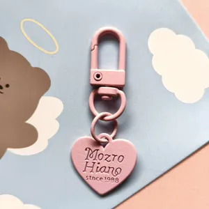 Pink metal keychain cute heart pendant detailed close up baked paint accessory charm