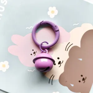 Candy color metal spring ring and bell keychain pendant for bag decoration and DIY crafts.