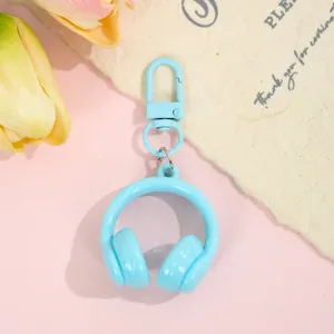 Cute pastel blue headphone keychain, stylish bag charm and creative accessory for daily use.
