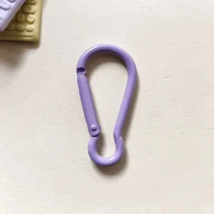 Close-up detail view of the purple aluminum alloy mini gourd snap hook keychain accessory.
