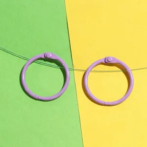Close-up detail of purple metal binder rings, 30mm open loose-leaf loose rings for DIY crafts.