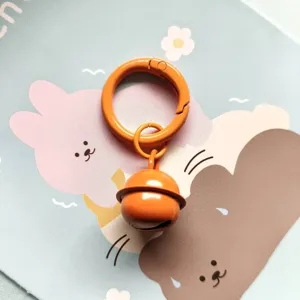 Candy color metal spring buckle ring with a cute bell, stylish keychain bag pendant accessory.