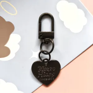 Metal heart keychain pendant, gunmetal finish with lobster clasp and rings for DIY accessories.