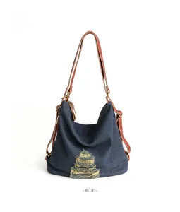 Close-up detail of the blue denim convertible backpack with brown leather straps and trim.