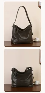 Dark brown leather hobo shoulder bag with soft texture, adjustable strap and secure zip closure.