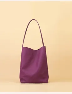 Purple leather shoulder bucket bag detail view, minimalist style, daily commuting wear.