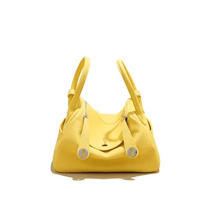 Mini yellow leather crossbody bag, stylish top handle shoulder purse with chic metal hardware.