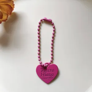 Pink heart pendant keychain with ball chain cute simple bag accessory for everyday use.