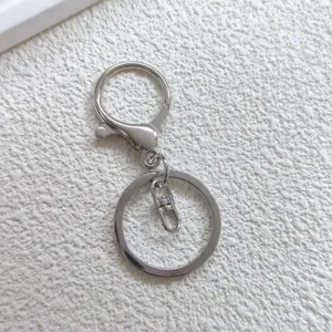 Silver metal keychain detail, lobster clasp and split ring accessories for DIY bags and toys.