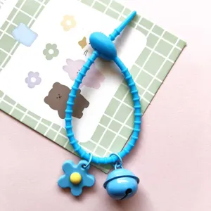 Blue silicone cable tie strap with cute flower pendant and bell for diy bag charm accessory