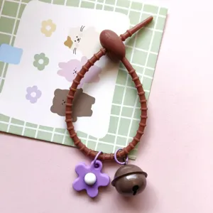 Candy color silicone cable tie keychain with cute purple flower and brown bell pendant for diy bag