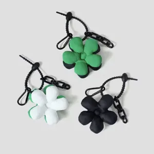 Puffer flower bag charm and keychain pendant, stylish padded floral backpack accessory set.