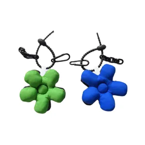 Trendy puffy flower bag charm and car keychain pendant set in green and blue colors.