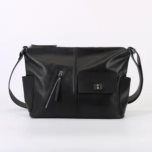 Classic black leather crossbody shoulder bag for men and women minimalist commuter design.