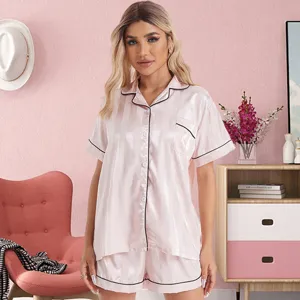 Detail view of the pink striped ice silk pajama set featuring short sleeves and lapel collar.