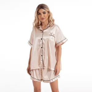 Silk satin short sleeve pajama set for women, elegant sleepwear with black contrast piping.