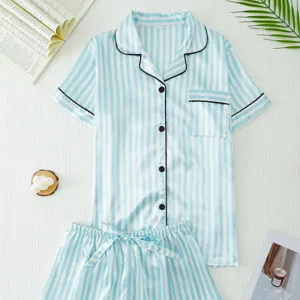 Detail view of light blue striped satin pajama set, short sleeves, comfy loungewear flat lay.