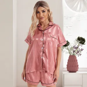 Women elegant pink satin striped pajama set with short sleeve button-down top and shorts.