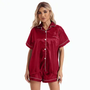Silk pajama set for women featuring short sleeves and matching shorts with contrast white piping.