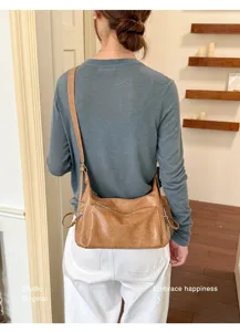 Brown vintage soft leather shoulder bag for women, stylish casual crossbody bag detail.