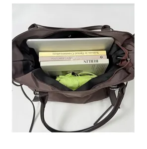 Large capacity canvas shoulder tote bag for women casual commuting and daily school use.