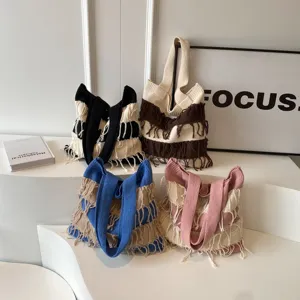 Fashionable knit tote bag with fringe, large capacity casual shoulder bag for daily use.