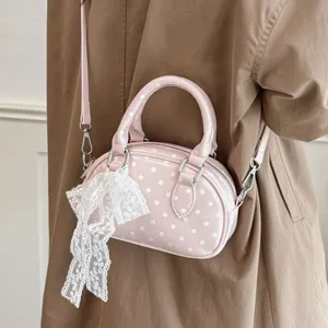 Pink polka dot handbag for women, casual niche style shoulder and crossbody bag with bow.