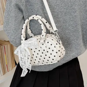 Chic white polka dot handbag for women, featuring a cute lace bow, stylish shoulder crossbody bag.