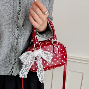 Chic red polka dot handbag for women, stylish lace bow shoulder crossbody bag main view.