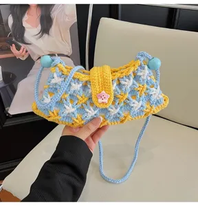 Chic blue yellow knitted shoulder crossbody bag for women, cute handmade crochet design.