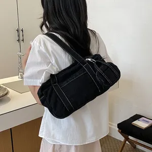 Black canvas shoulder bag for women, trendy daily casual crossbody bag with contrast stitching.