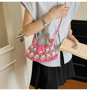 Stylish pink and grey crochet crossbody bag with cute star pattern and pearl beads for women.