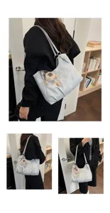 Detailed view of casual women's shoulder tote bag in light grey, featuring plush charm.