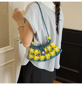 Handmade crochet shoulder bag for women, cute floral knit crossbody bag with star button.