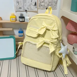 Süßer gelber Schulrucksack mit Schleifen und transparenter Vordertasche für Schüler.