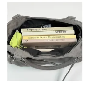 Grey suede shoulder underarm bag detail showing large capacity, retro casual commute style.
